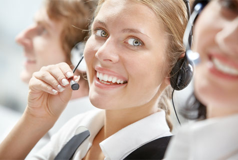 Image of woman on a headset phone.